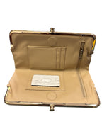 Gold kiss-lock clutch wallet